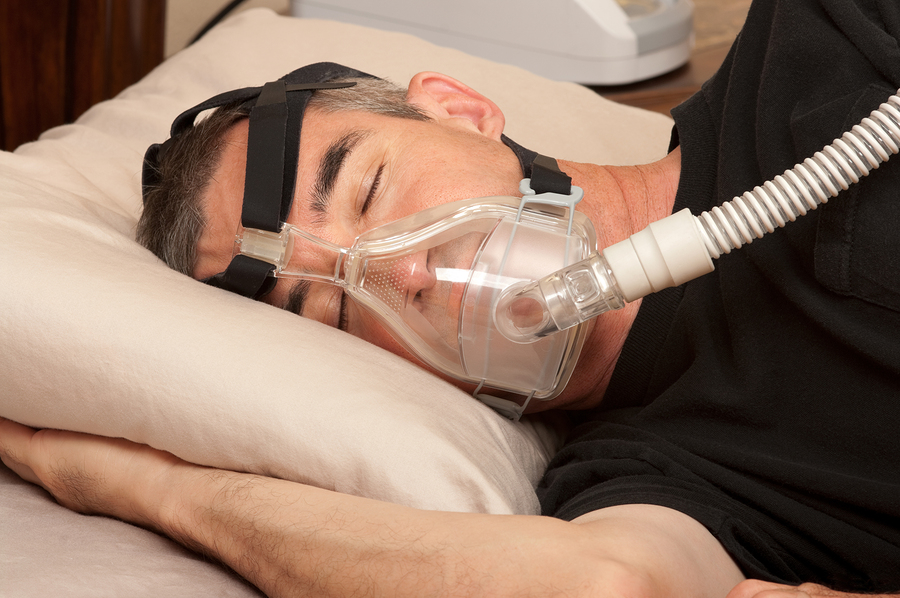 bigstock-Man-with-sleeping-apnea-and-CP-38537938